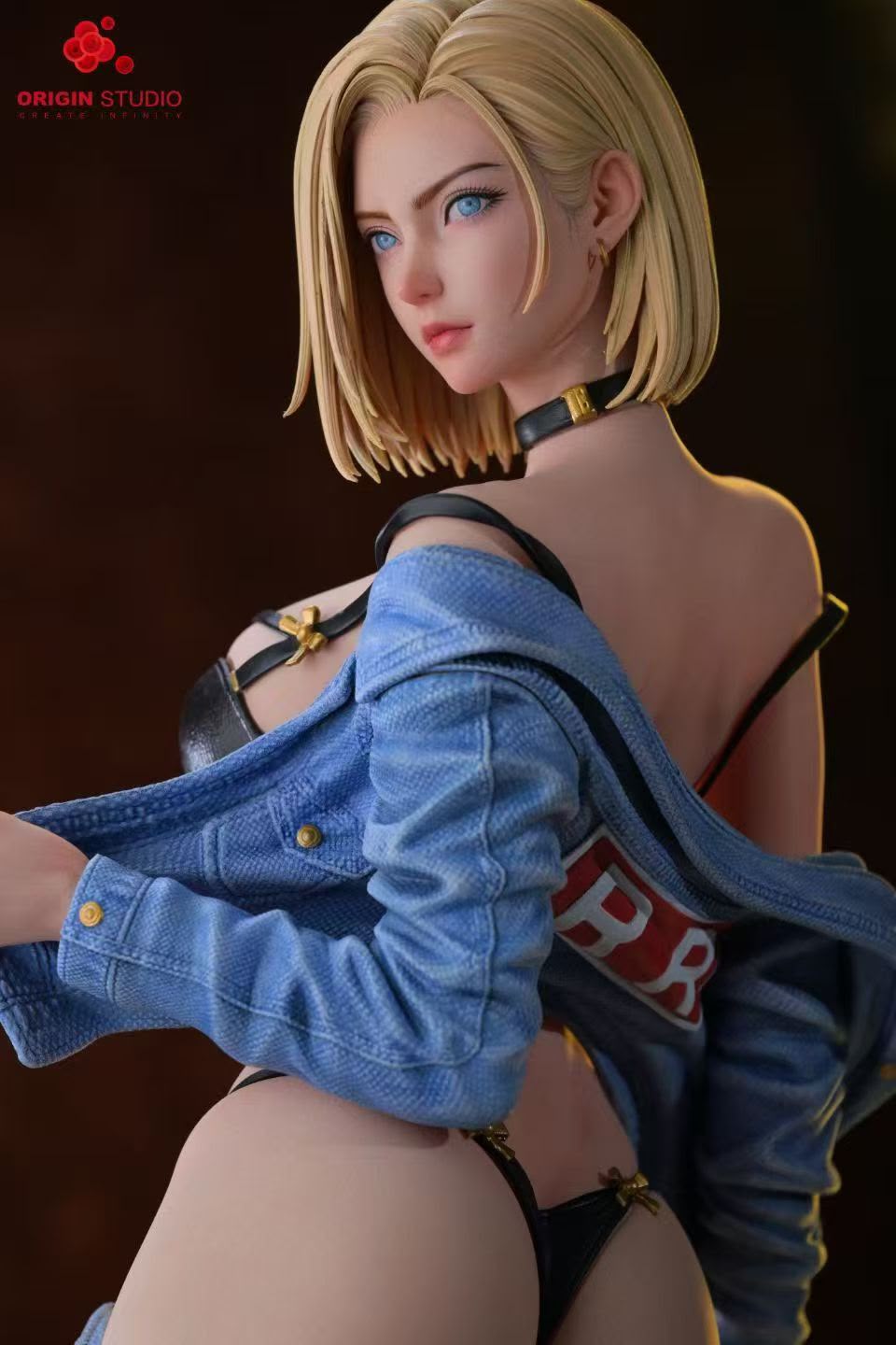A collectible statue of a blonde anime character shown from behind, wearing a blue denim jacket over a black bra and thong, with a choker, against a dark brown background. The Origin Studio logo is visible in the top-left corner.